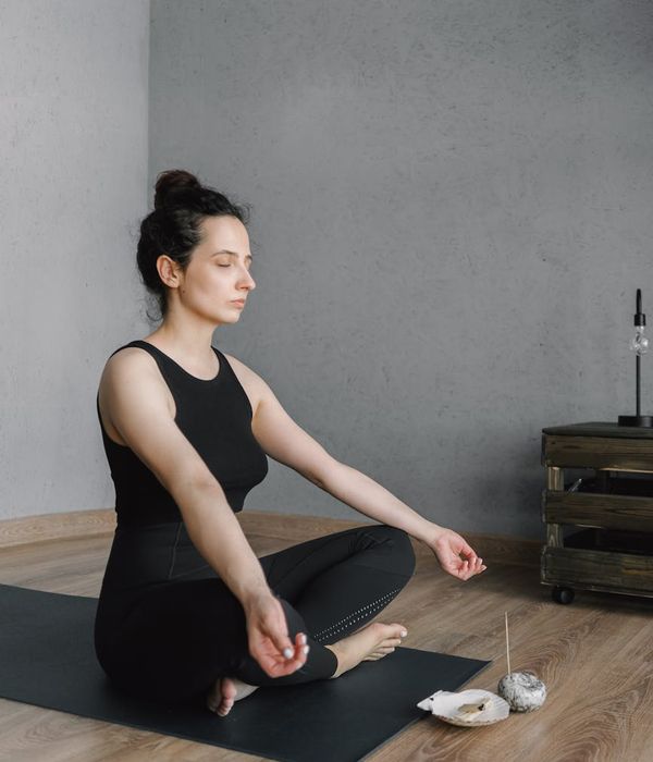 Person meditating peacefully, representing mental clarity and calmness.